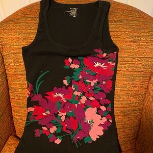 Women’s black tank top w purple/pink floral pattern on the front. Size L.